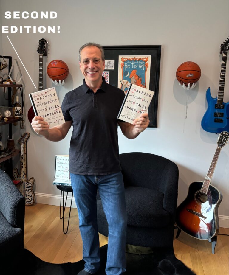 sales leadership training and coaching books being held by keith rosen in his sales coaching office