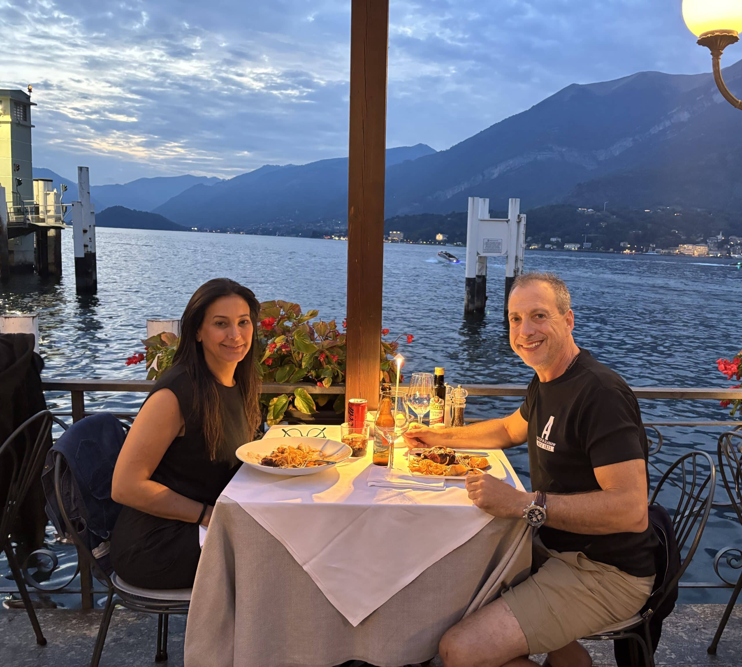 Phone addiction and relationships shown through people choosing real conversation over scrolling at dinner.