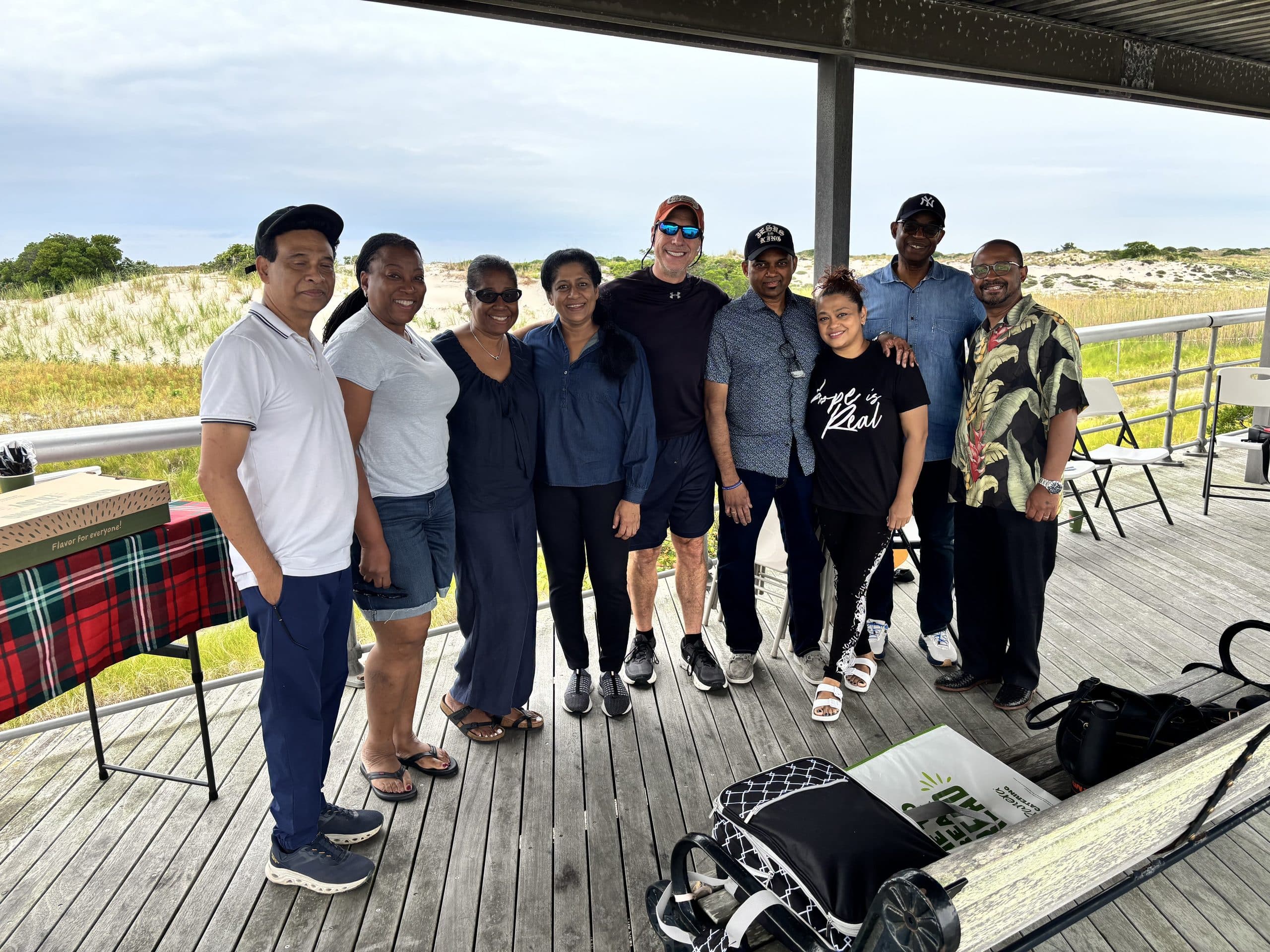 Keith Rosen with a morning prayer group at Jones Beach, illustrating empathy in leadership