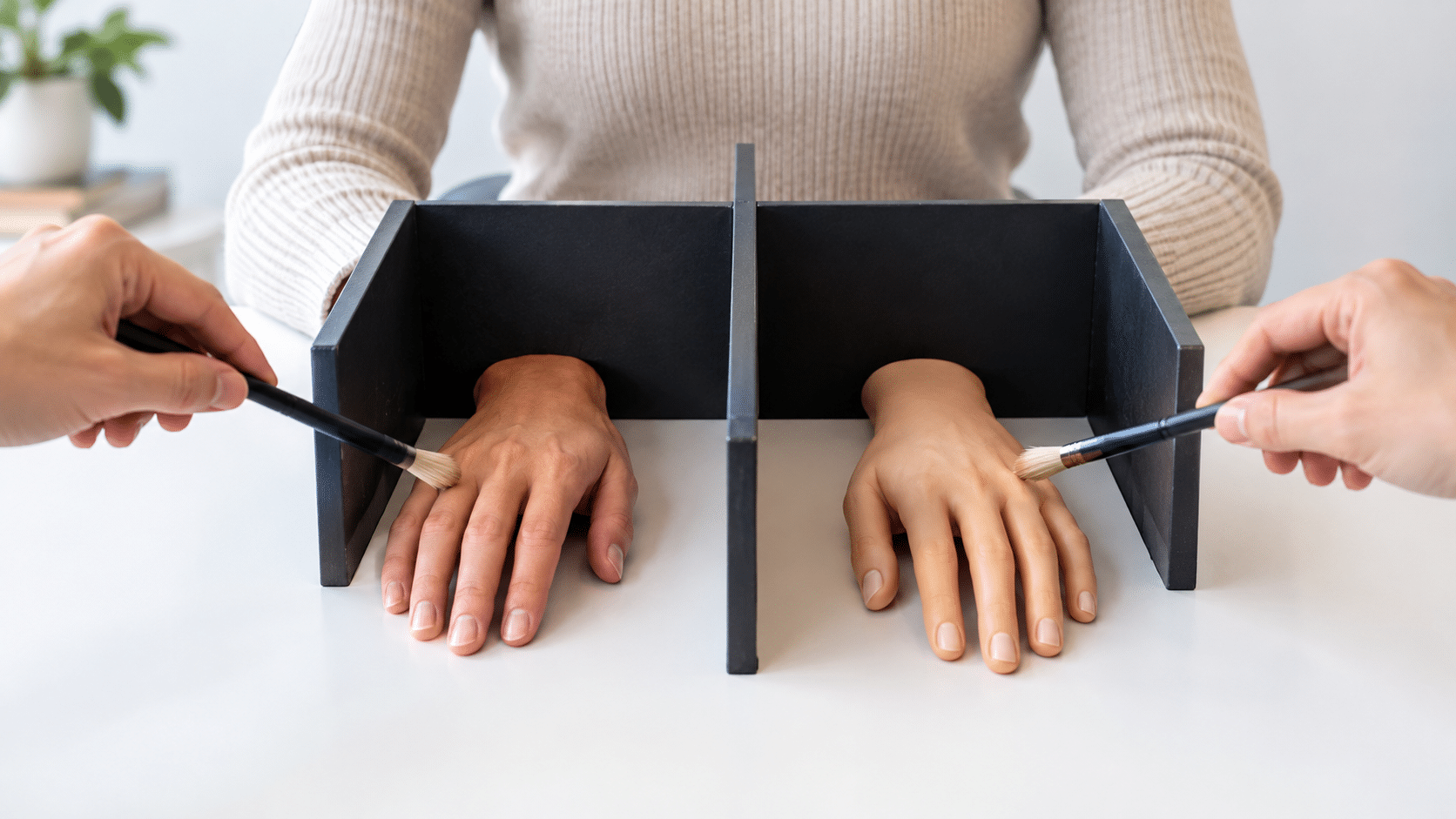 Illustration of the Rubber Hand Illusion connecting an artificial hand with the concept of cross-functional team alignment.